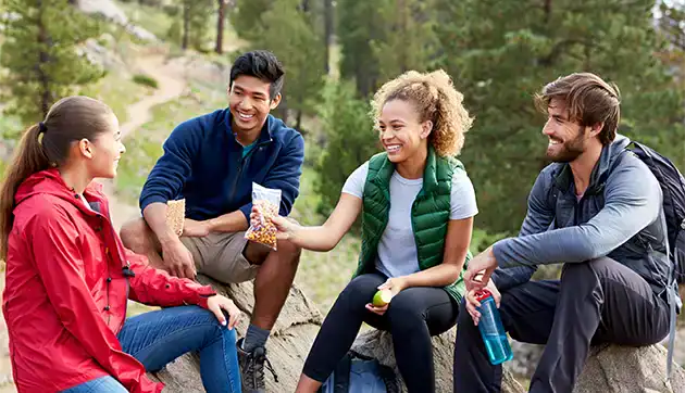 college students hikers taking break