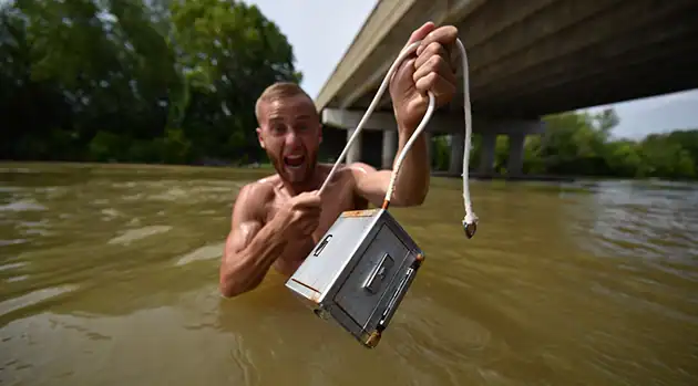 excited man with metal case
