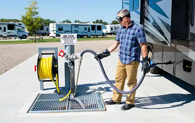 man at rv pump waste station